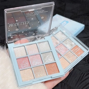 Close-up of a 9-color eyeshadow palette with shimmer, matte, and glitter textures in rose pink