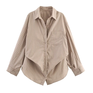 Detail of tan striped long sleeve shirt featuring a unique asymmetric wrap hem and lapel