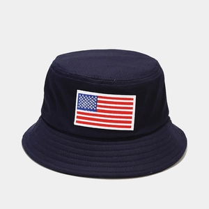 Close-up detail of American flag embroidery on dark blue cotton sun bucket hat