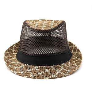 Close-up of brown straw fedora featuring breathable dark mesh panels and black band