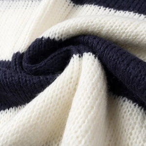 Close-up of thick navy and cream striped knit fabric showing soft texture and weave