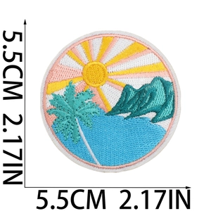 Detailed embroidery of a tropical landscape patch with sun and palm trees, 5.5cm diameter