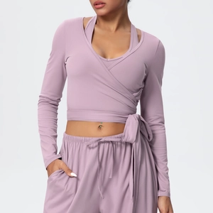 Detail of Morandi purple yoga top with cross-wrap tie design and adjustable waist cord