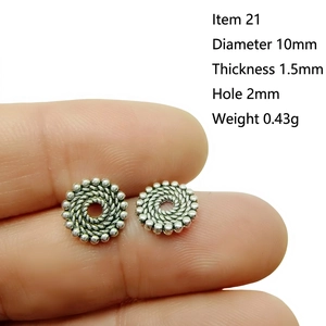 Macro detail of 10mm silver alloy spacer bead with rope texture for DIY jewelry making