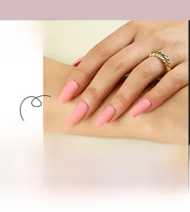 Macro detail of matte pink ballerina press-on nails with frosted texture on hand