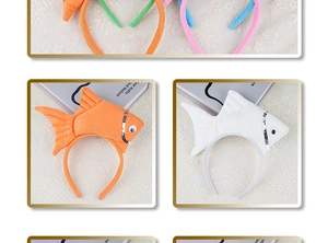 Detail of plush orange and white fish headbands with decorative sequins for costume parties
