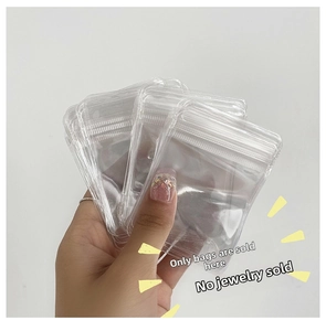 Close-up of transparent PVC jewelry storage bags with secure self-sealing zipper closures