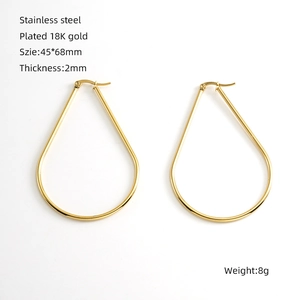 Detail view of 18K gold plated stainless steel geometric earrings with size parameters