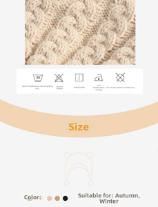 Detail of baby knit hat with cable pattern, ear protection and washing instructions