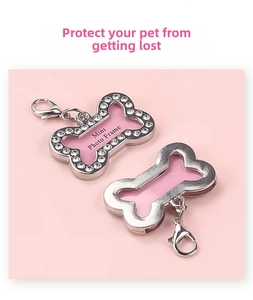 Detail of bone-shaped pet ID tag with sparkling rhinestones and pink photo frame