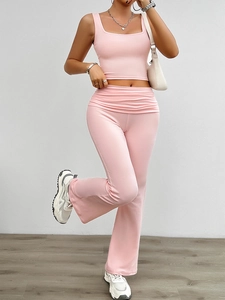 Detail of pink square neck sleeveless crop top and high waist flared trousers set