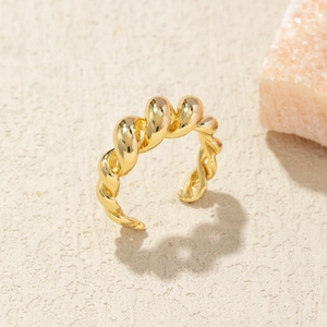 Polished gold twisted open ring for women with a minimalist metallic mirror finish