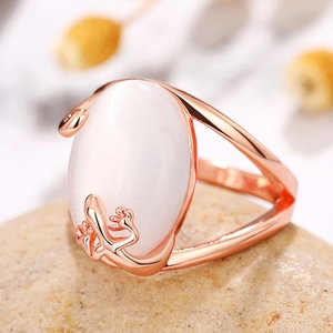Elegant rose gold ring with large oval white faux jade stone and vine details