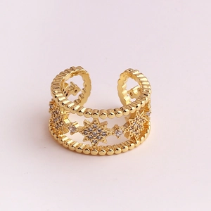 Detail of gold-plated star ring featuring micro-pave zircons and beaded edge craftsmanship