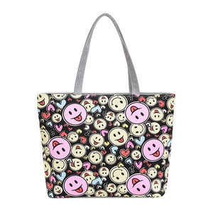 Spacious casual tote bag with colorful cartoon smiley print and grey canvas handles