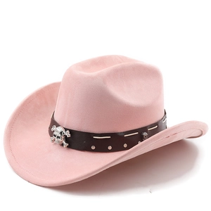 Detail of pink faux suede cowboy hat featuring leather band and silver skull ornament
