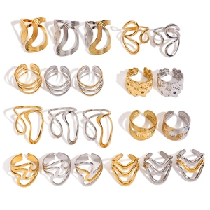 Collection of irregular geometric gold and silver titanium steel rings in various styles