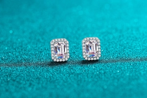 Macro detail of S925 sterling silver emerald cut radiant halo stud earrings