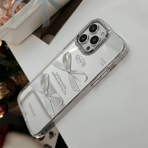 Detail of clear iPhone case with 3D silver pearl bows and French typography design