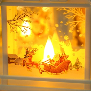 Detail showing Christmas lantern with warm LED light and Santa silhouette scene