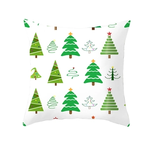 Detail of Christmas pillowcase with festive green tree patterns on white background
