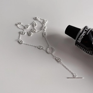 Detail of 925 sterling silver anchor link necklace featuring a stylish OT toggle clasp