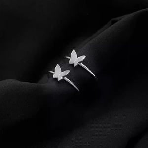 Elegant 925 silver plated butterfly rings on black fabric for a minimalist luxury look
