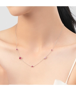 Close-up of S925 sterling silver necklace with delicate red and pink zircon stones