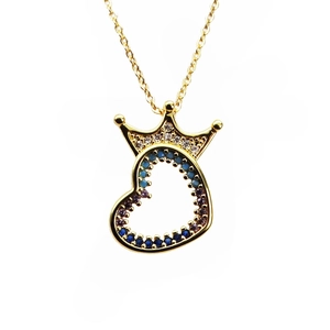 Macro view of gold crown heart pendant with colorful micro-set cubic zirconia stones
