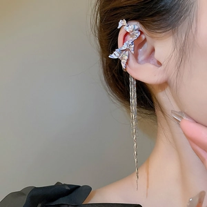 Close-up of long tassel butterfly ear cuff on model showing silver chain detail