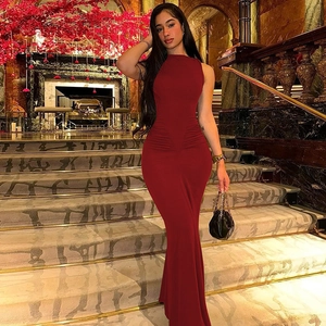 Close-up of deep red sleeveless slim-fit maxi dress with elegant waist pleat details