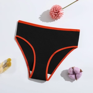 Women's black rib-knit cotton panties with orange piping on plain white background