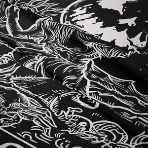 Close-up of bohemian gothic tapestry showing moon and mystical art on soft textile