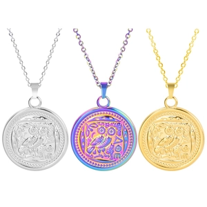 Detailed comparison of owl coin pendants in gold, silver, and iridescent finishes