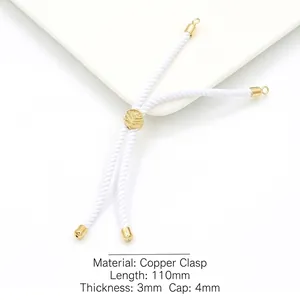 Macro view of 3mm white braided cord with 18k gold plated tree of life slider clasp