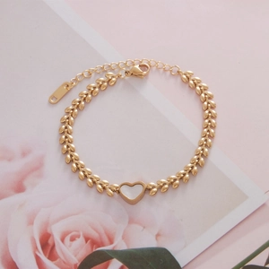 Golden titanium steel heart bracelet with leaf chain and white shell inlay detail