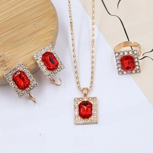 Detail of red rectangle gemstone jewelry set including necklace, earrings and ring