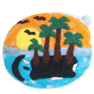 Handmade tropical island sunset wool felt patch featuring palm trees and a sun