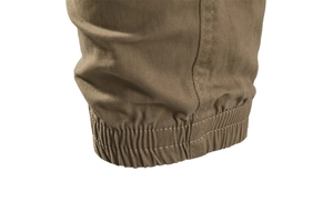 Detailed close-up of khaki cargo pants featuring elastic ribbed cuffs and double stitching