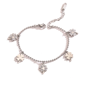 Detailed view of silver clover bracelet with sparkling zircon and beaded chain