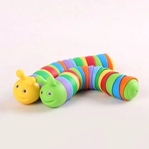 Slinky rainbow fidget slug toy with vibrant multi-colored segments on white background