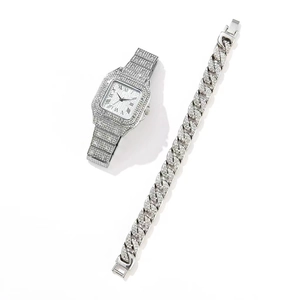 Detail of silver quartz watch and Cuban chain bracelet set with sparkling crystals