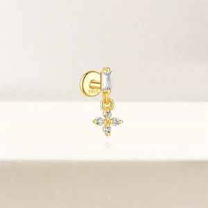 Detailed macro view of S925 sterling silver golden ear stud with sparkling zircon stones
