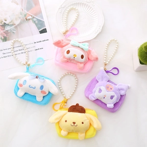 Close-up of plush Sanrio character coin purses with faux pearl handles and hooks