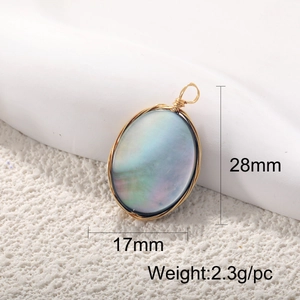 Macro shot of oval abalone shell pendant with handmade gold wire wrapping and size details