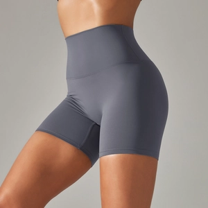 Detailed side view of high-waisted seamless yoga shorts in dark grey stretch fabric