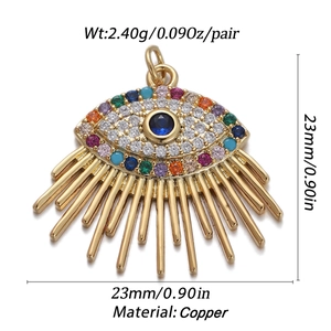 Detail of 23mm golden copper evil eye pendant with colorful zircons and metal tassels