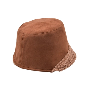 Detail of a brown suede bucket hat featuring soft lamb wool trim on the brim for winter