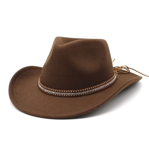 Brown western cowboy hat with rhinestone band and studs on a clean white background