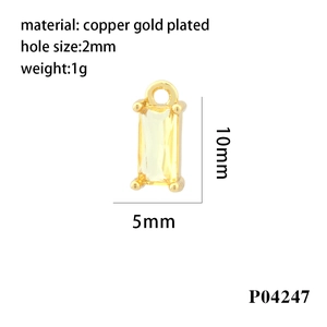 Detailed macro view of an 18K gold-plated copper rectangular pendant with yellow zircon